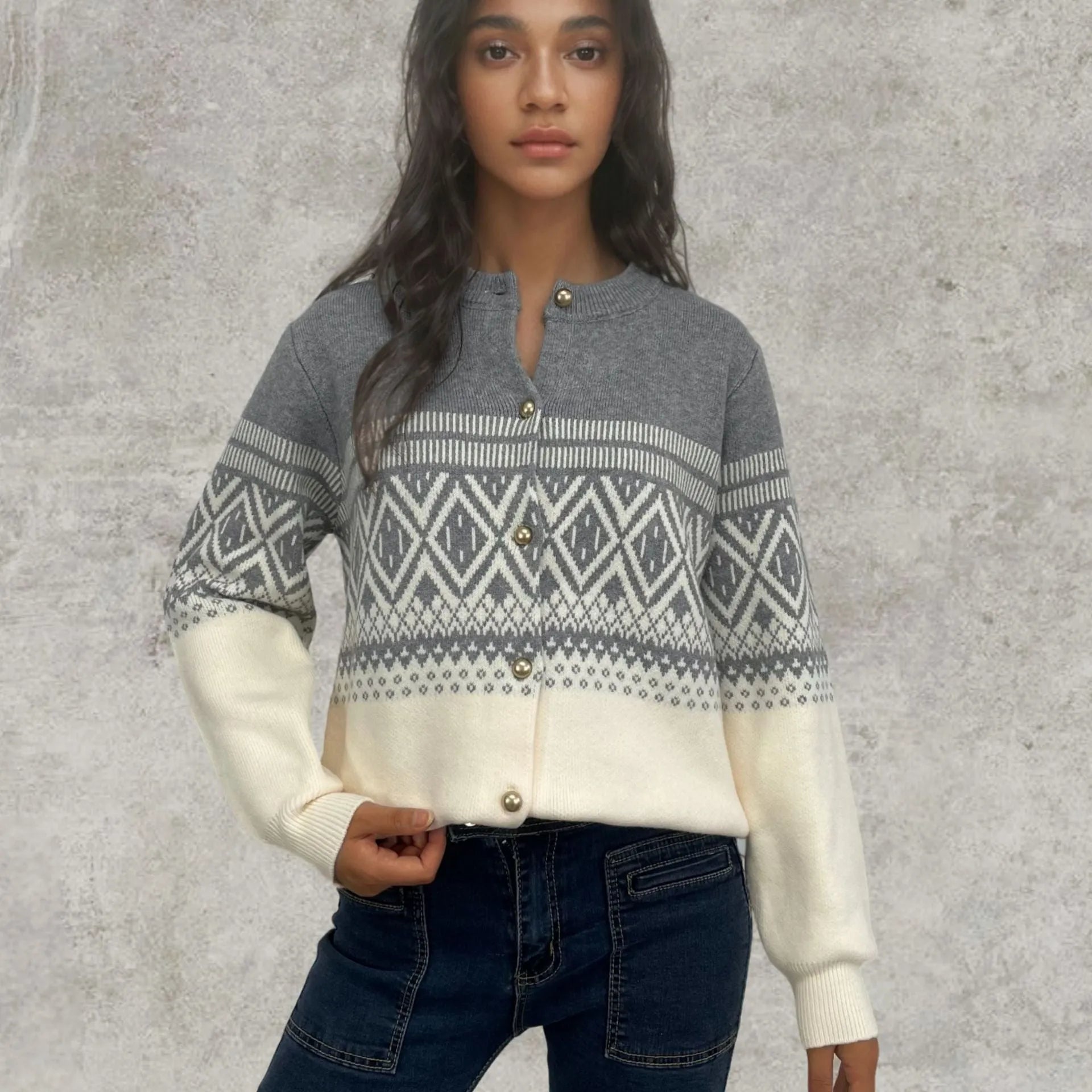 Red women's alpaca wool cardigan with grey diamond knit pattern and long sleeves.