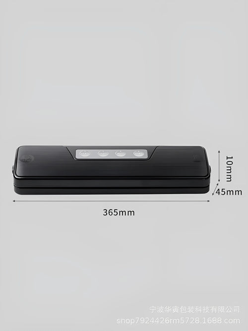 Small black automatic vacuum sealer machine on a kitchen countertop