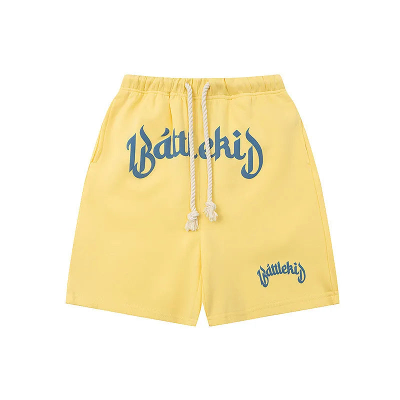 A pair of loose-fit black hip hop shorts made from cotton blend fabric on a mannequin.