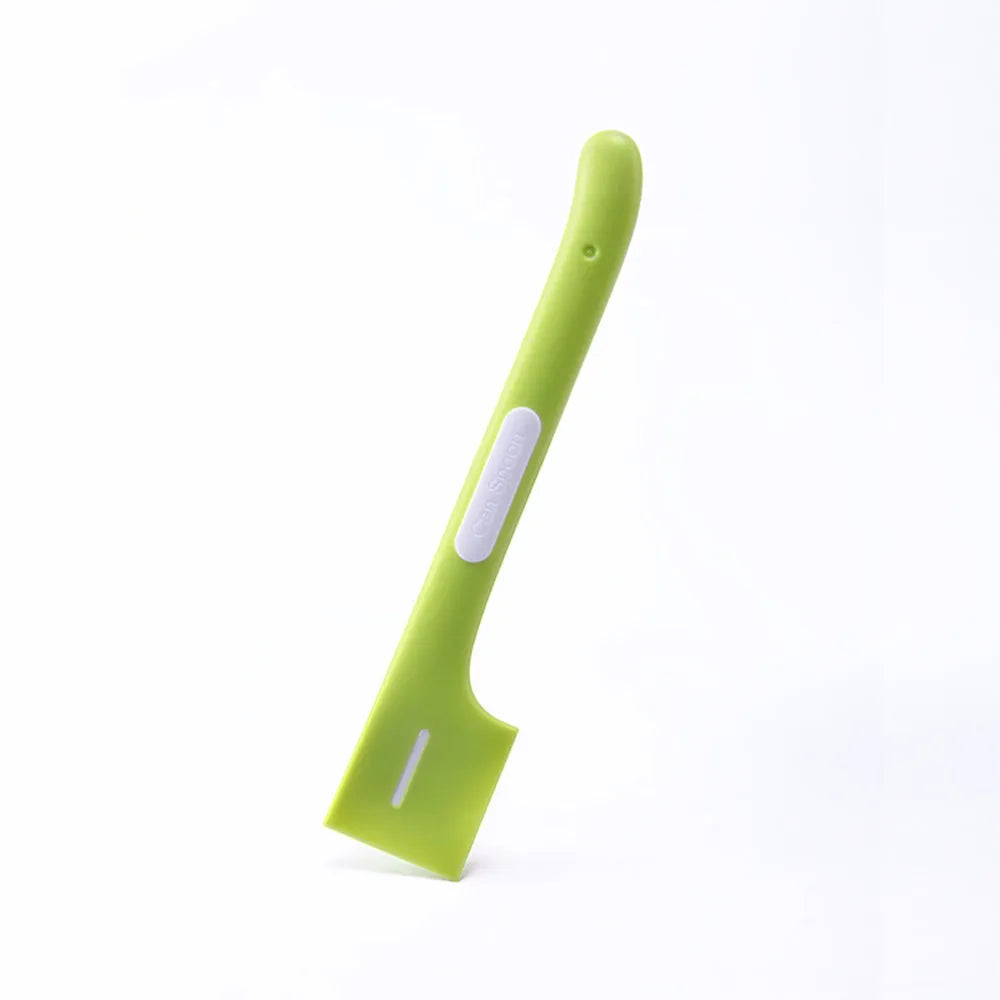 Long-handled pet feeding spoon in green colour with right-angle design for canned food