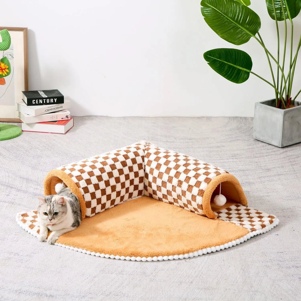 Fan-shaped plush pet bed with integrated tunnel for cats and small dogs in a plaid pattern.