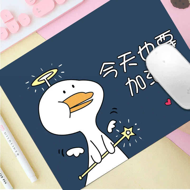 Custom cartoon thickening mouse pad on a desk, showing a colourful design with black stitched edge.