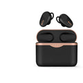 Black wireless Bluetooth headset with bilateral earpieces and a charging stand on a table.