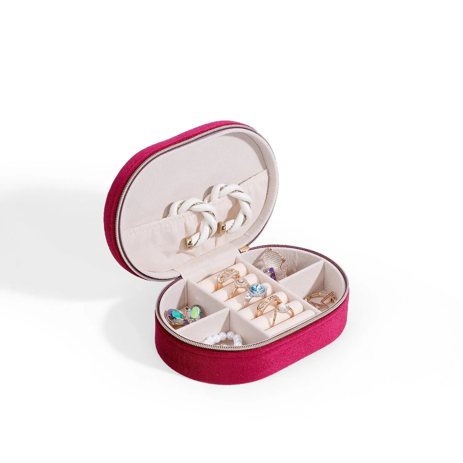 Oval velvet jewellery storage box in lake blue colour, showing flannel-lined interior and compact size.
