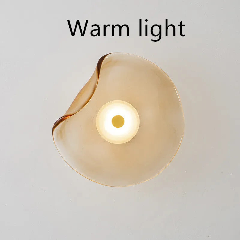 Round decorative wall lamp with glass shade for bedroom bedside lighting