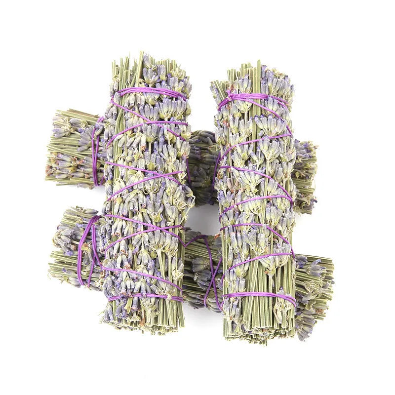A single 4-inch long lavender aromatherapy stick made from natural dried flowers on a plain background.