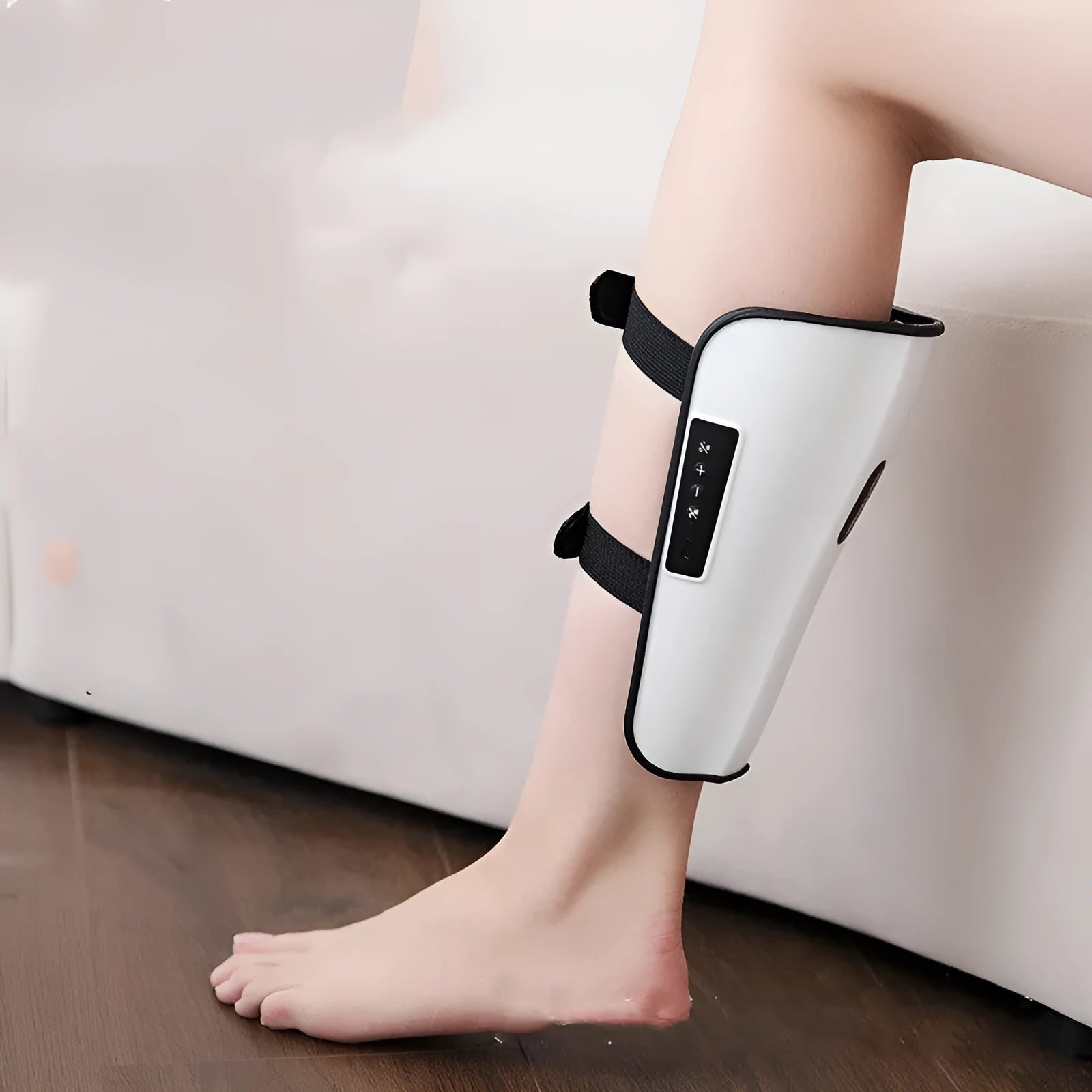 White plastic leg and calf massager unit with electrotherapy pulse and heating functions