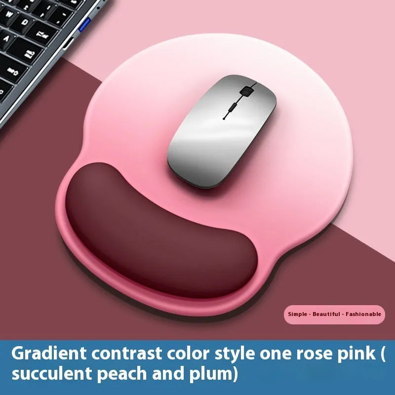 Silicone mouse mat with wrist rest in gradient colour pattern on desk
