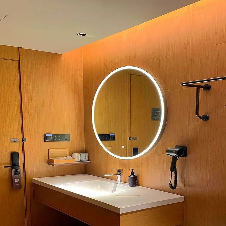 Black frame round smart LED bathroom mirror with touch control mounted on wall