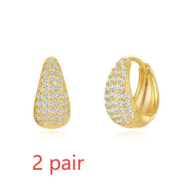 Golden electroplated brass earclip earrings with geometric round design