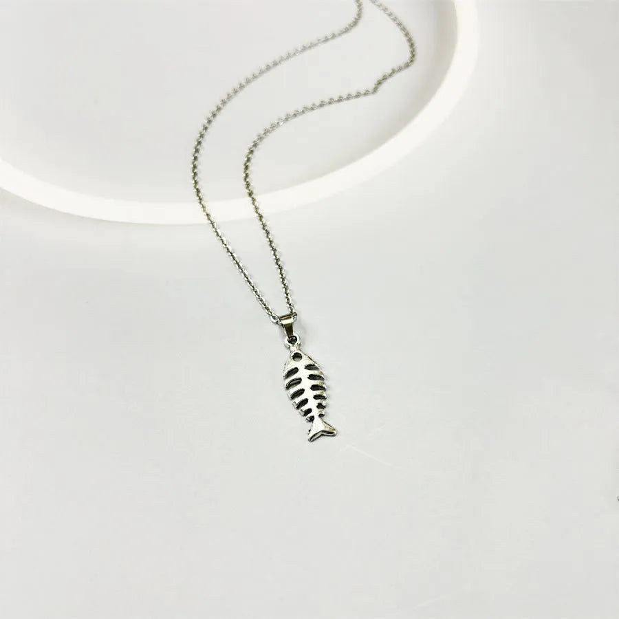 Fishbone pendant necklace and matching earrings set in retro style with adjustable length jewellery