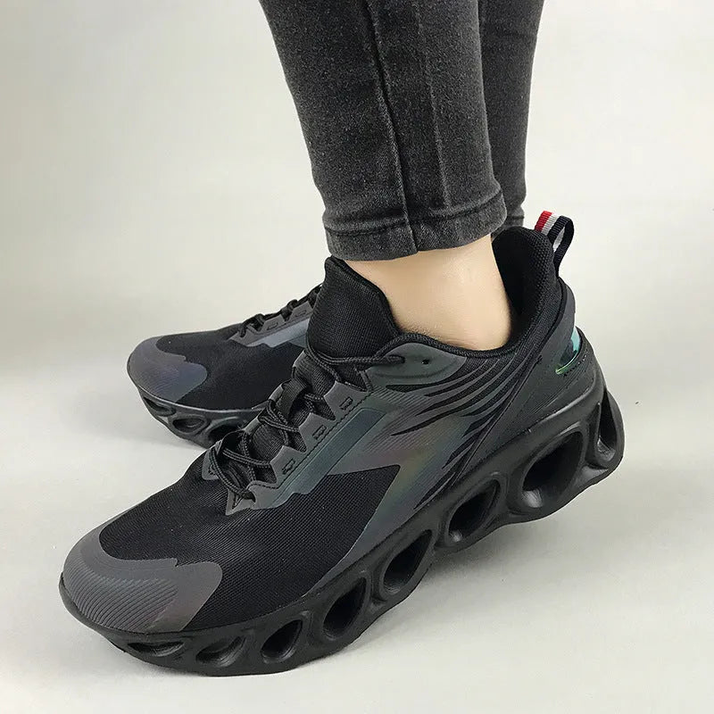 Men's casual sports shoes with mesh upper in black colour showing lace-up front and EVA sole