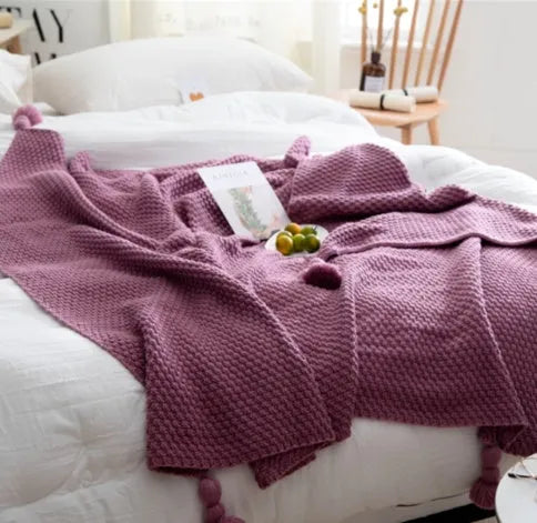 Nordic fringe knit ball blanket in beige colour on sofa, showing 130×170cm dimensions and fringe detailing.
