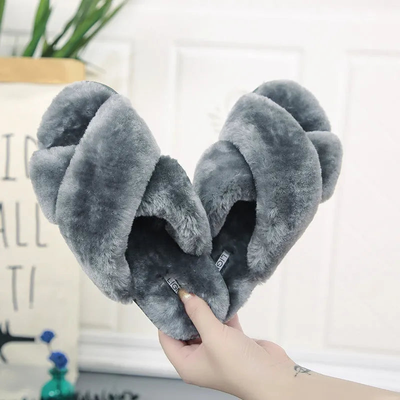 Women's cross open-toe fur slippers in black showing non-slip sole pattern