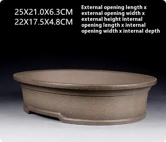 Handmade purple sand clay bonsai pot with antique oval design measuring 25x21x6.3cm
