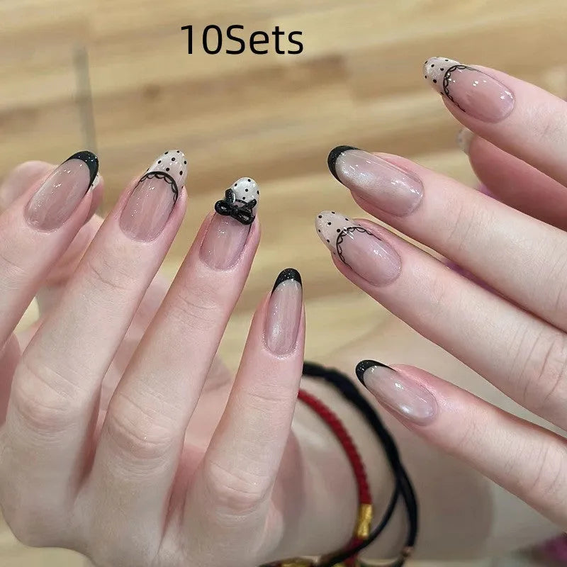 A set of artificial press-on false nails for women in assorted random colours and patterns.