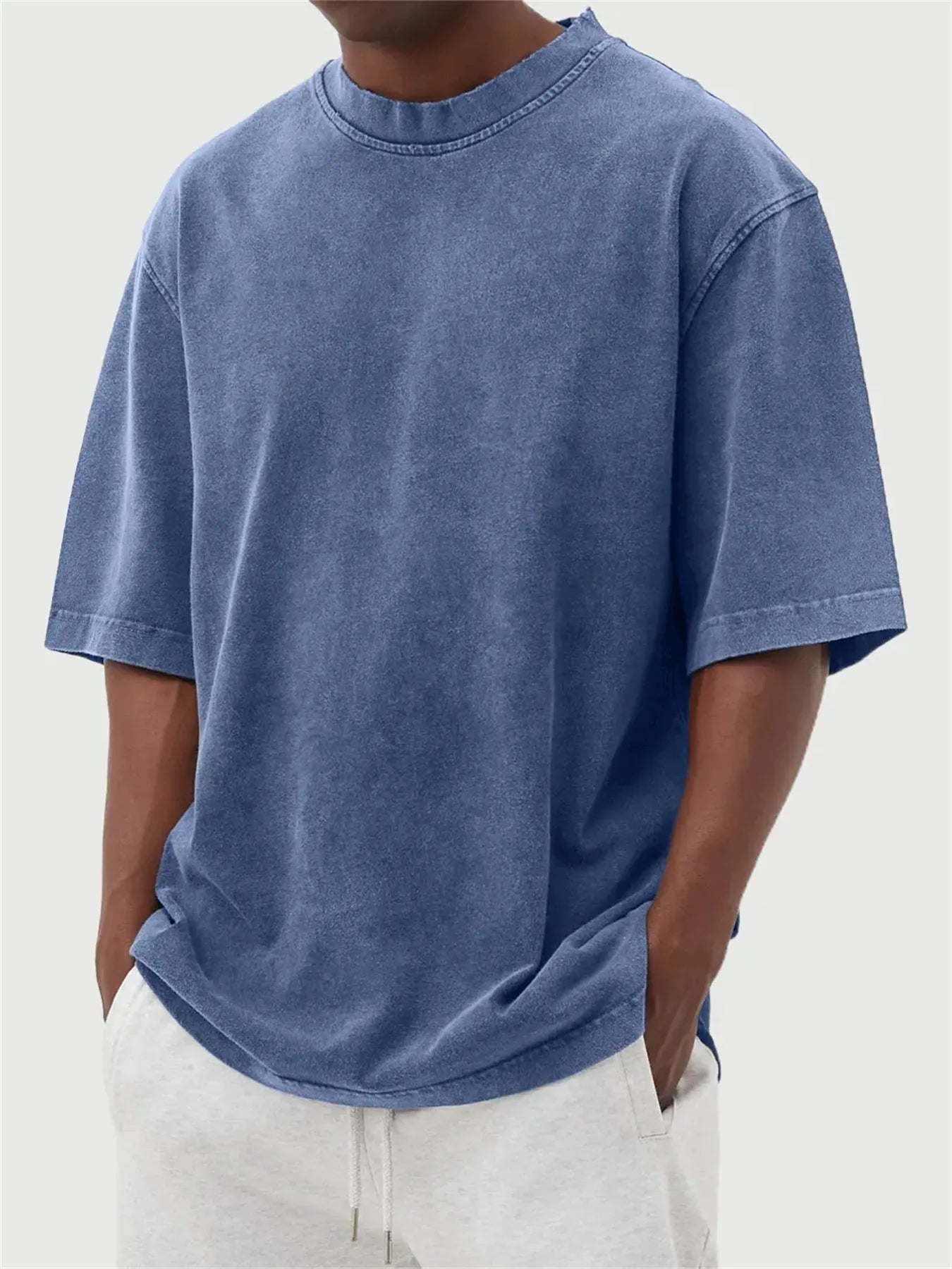 Men's washed distressed pullover t-shirt in solid colour with loose fit and stone washed finish