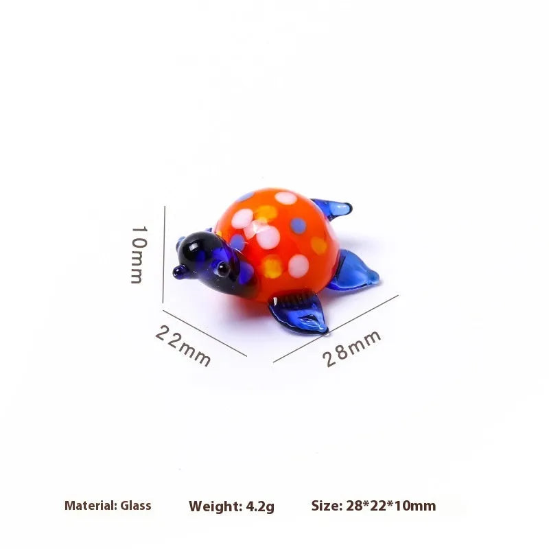 Geometric glass turtle desktop ornament in modern simplicity style on a wooden surface.