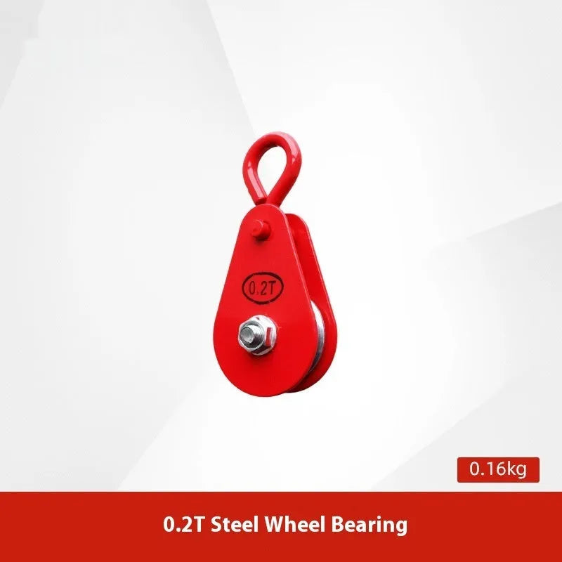 Red industrial steel lifting pulley with a safety latch on the hook.