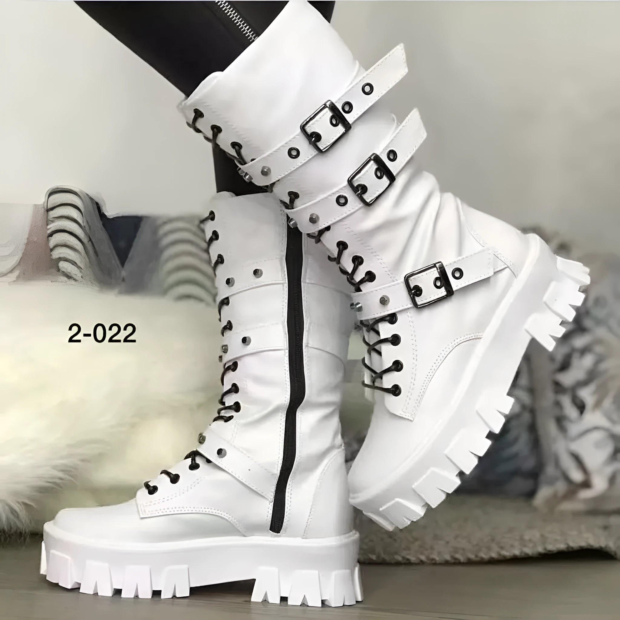 Women's black mid-calf boots with a metal buckle strap and side zipper, made of artificial PU leather.