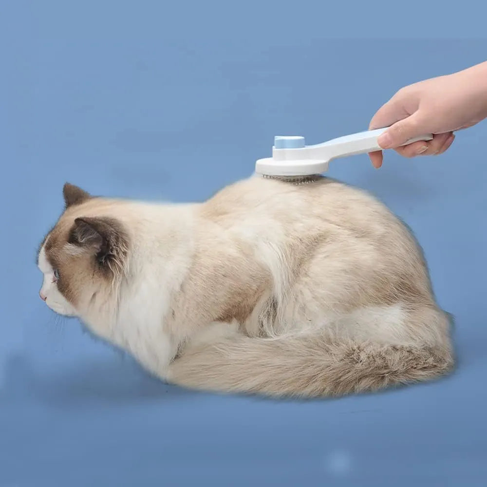 Blue self-cleaning cat and dog brush with rubber handle and retractable pins