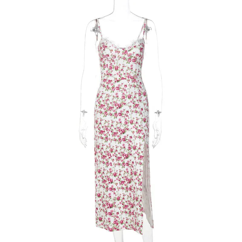 Women's blue long dress with white lace flower print, side slit, and thin adjustable suspender straps.
