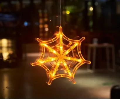 Halloween window hanging LED lights with suction cups showing multiple horror-themed designs powered by batteries