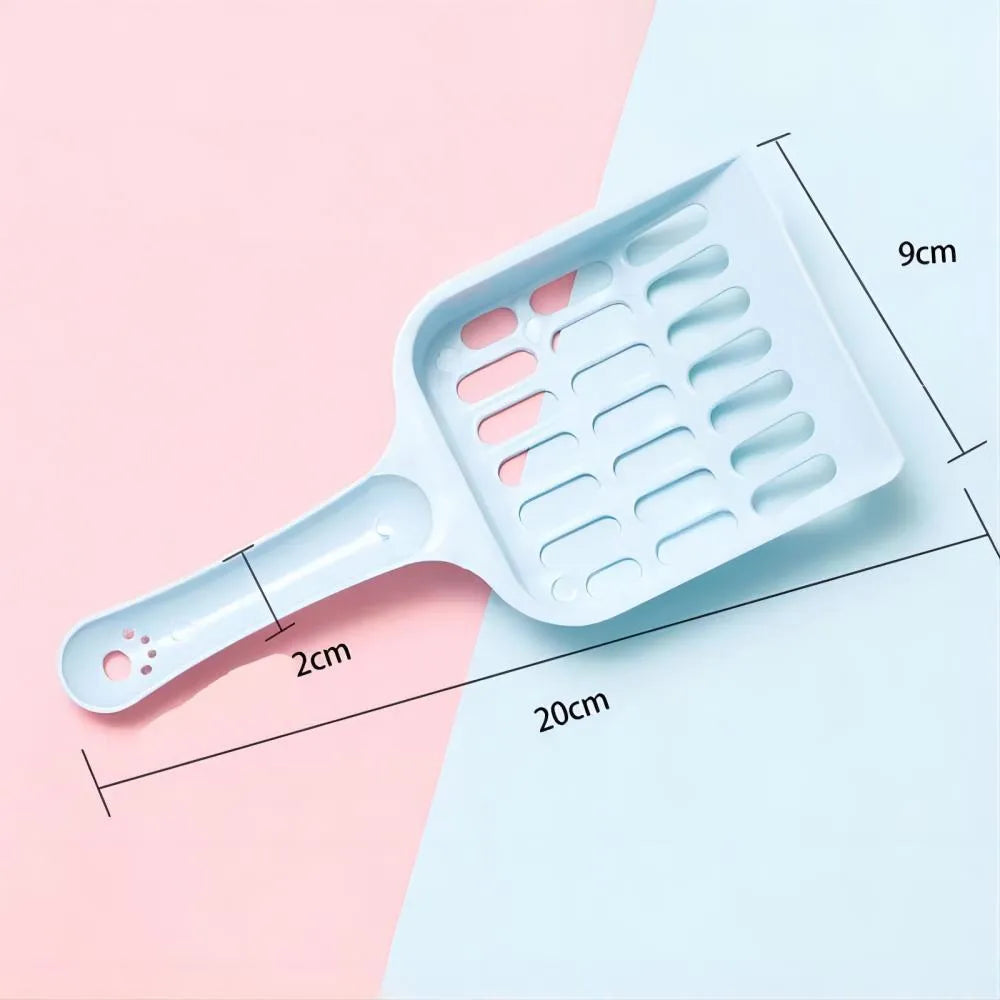 Blue plastic cat litter scoop on a white background