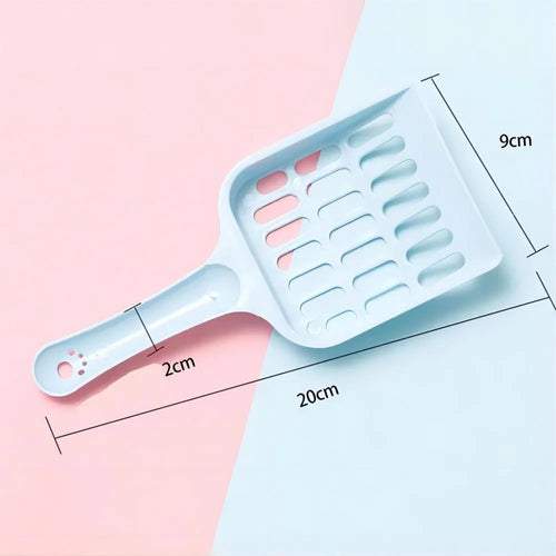Blue plastic cat litter scoop on a white background
