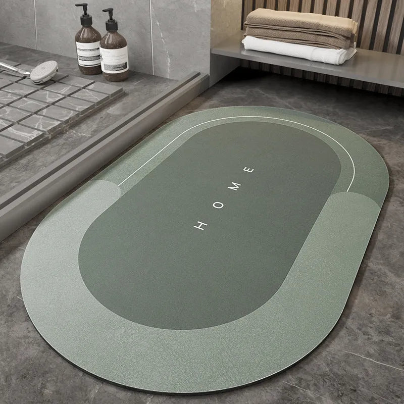 Blue oval blended fabric bathroom floor mat on a tiled floor
