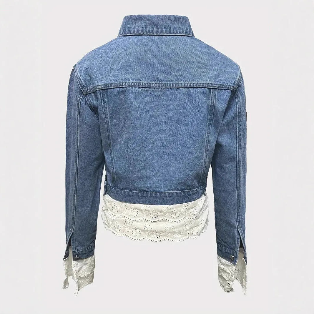 Blue women's denim jacket with lace stitching detail on the sleeves and front, featuring long sleeves.