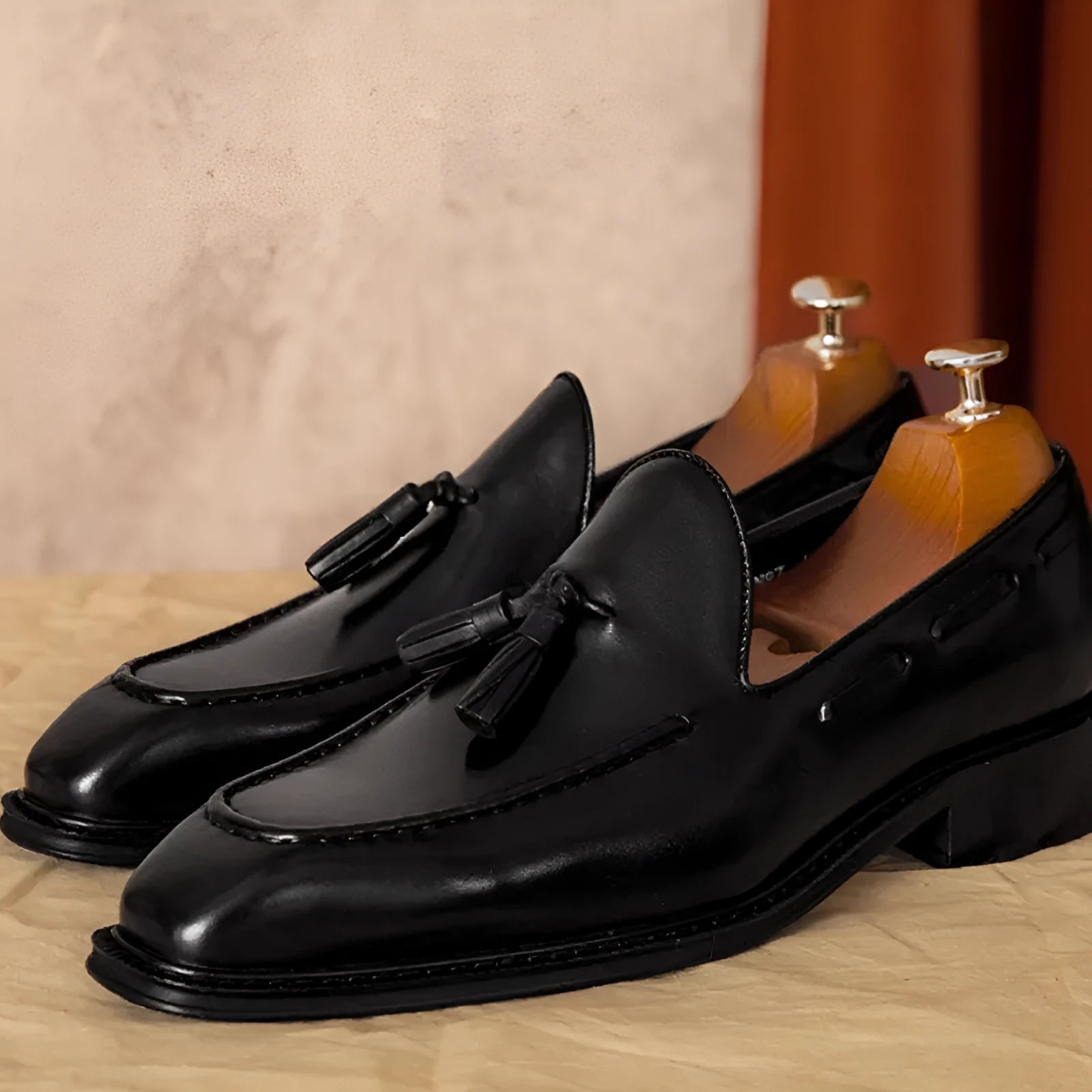 Men's black genuine leather slip-on loafers with fringed design and rubber sole