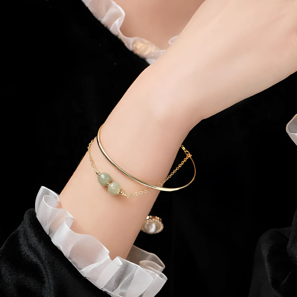 Women's jade bracelet with gold inlay detailing showing single, double and three bead versions
