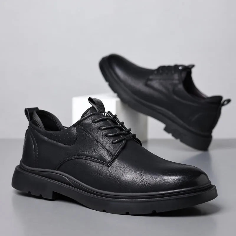 Men's black and brown leather casual sneakers with rubber soles and sewn detailing