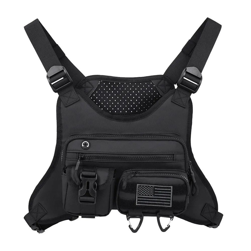 Men's black Oxford cloth chest bag worn as a vest, showing sewing line details and buckle closures.
