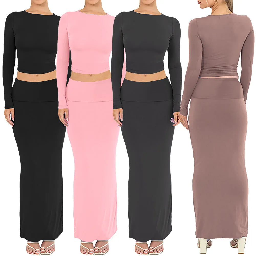Women's black slim fit polyester two-piece suit with three-quarter sleeve top and long skirt.
