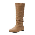 Women's black slip-on flat ankle boots with round toe and rubber sole.
