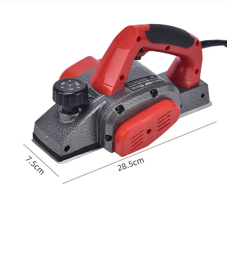 Red electric wood planer with aluminium housing showing 82mm planing width and power specifications