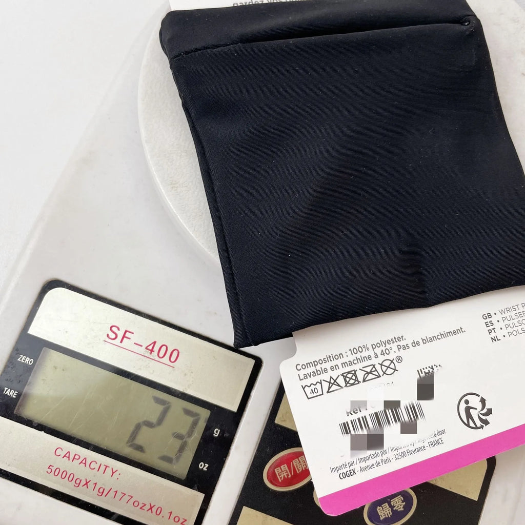 Wrist bag armband sleeve for mobile phone, shown in packaging, dimensions 10 by 10.5 cm.