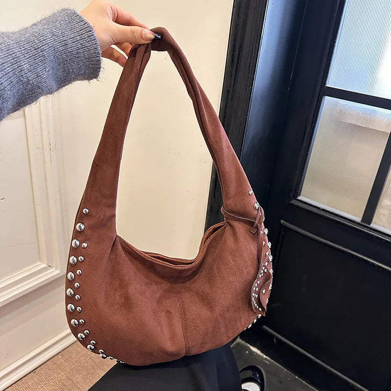 Soft plush retro tote handbag for women in a choice of colours, shown with strapless underarm carry.