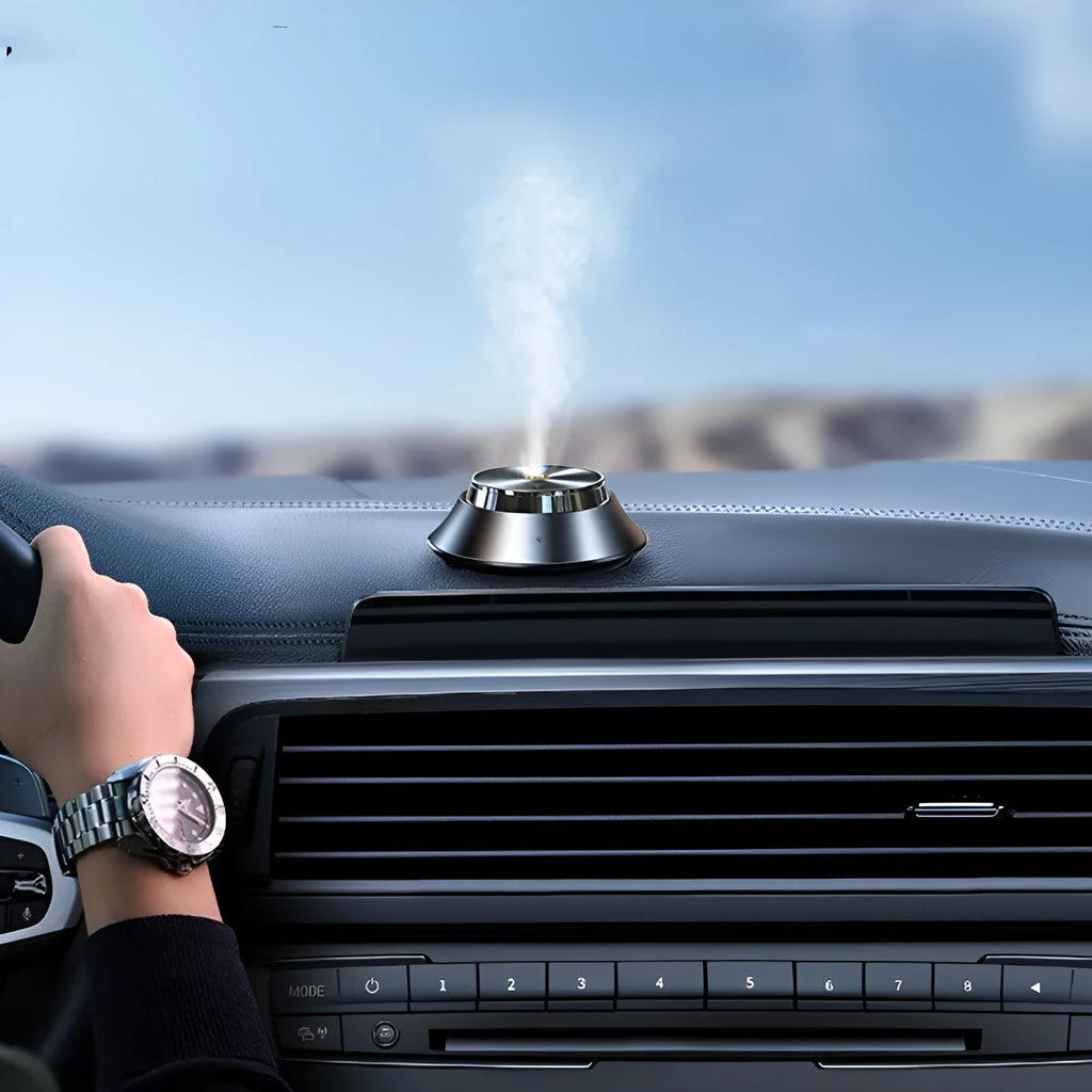 Black metal butterfly-design car aromatherapy unit with USB cable and 50ml essential oil bottle