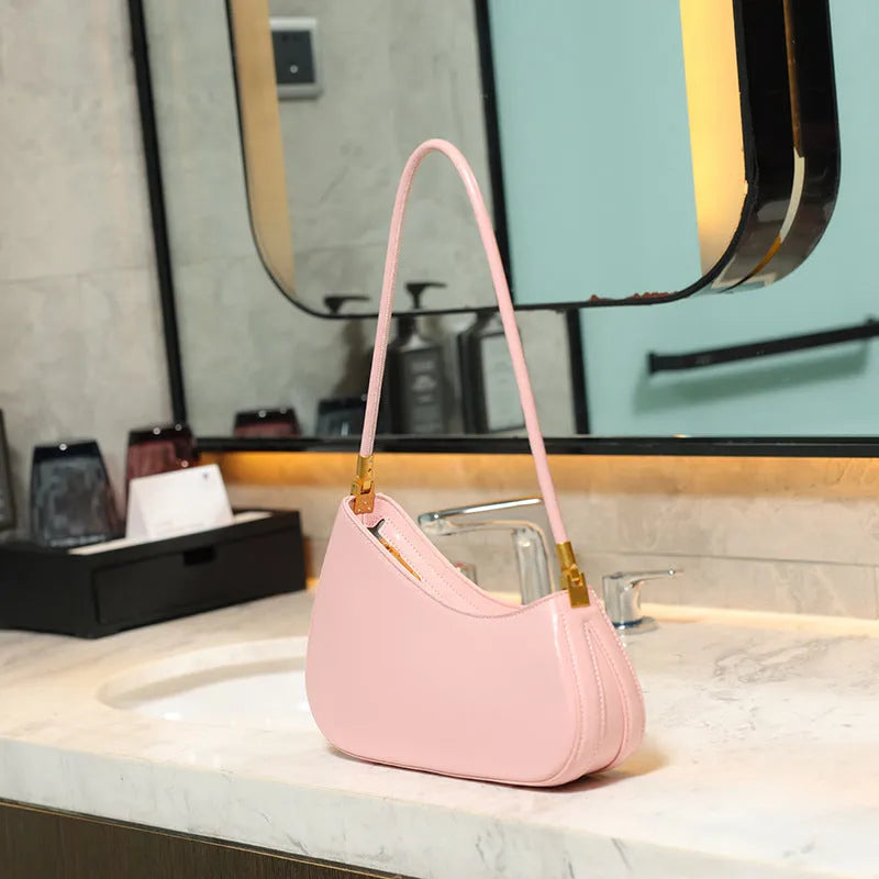 Women's retro oval PU leather shoulder bag in seven colour options with single strap and internal zipper compartment