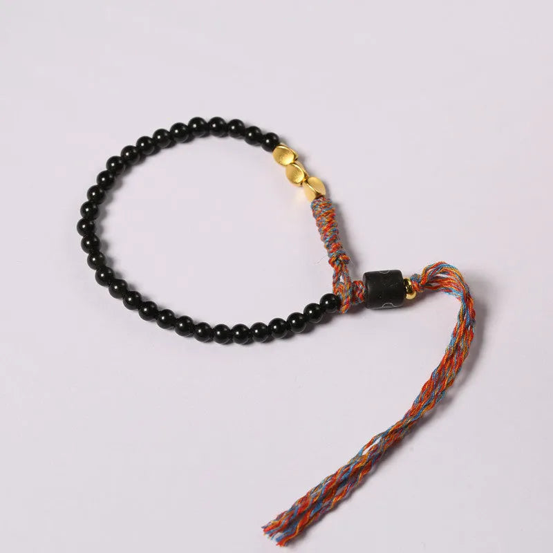 Hand-woven obsidian bracelet strap showing textured detail and 4mm width