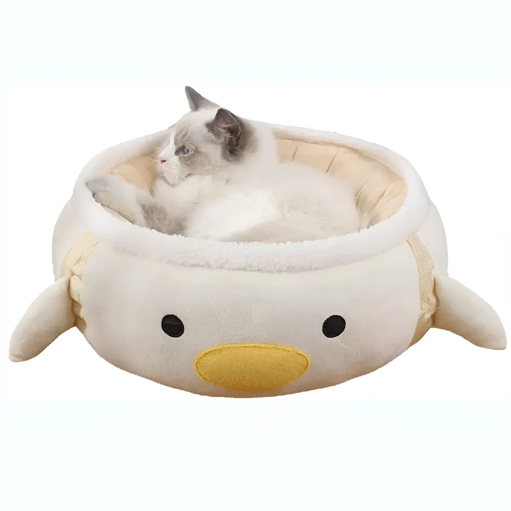 Green dinosaur and chick shaped cat bed shown both flat and hanging as a hammock