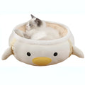 Green dinosaur and chick shaped cat bed shown both flat and hanging as a hammock