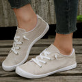 Women's creamy-white fabric low-top casual sneaker with rubber sole
