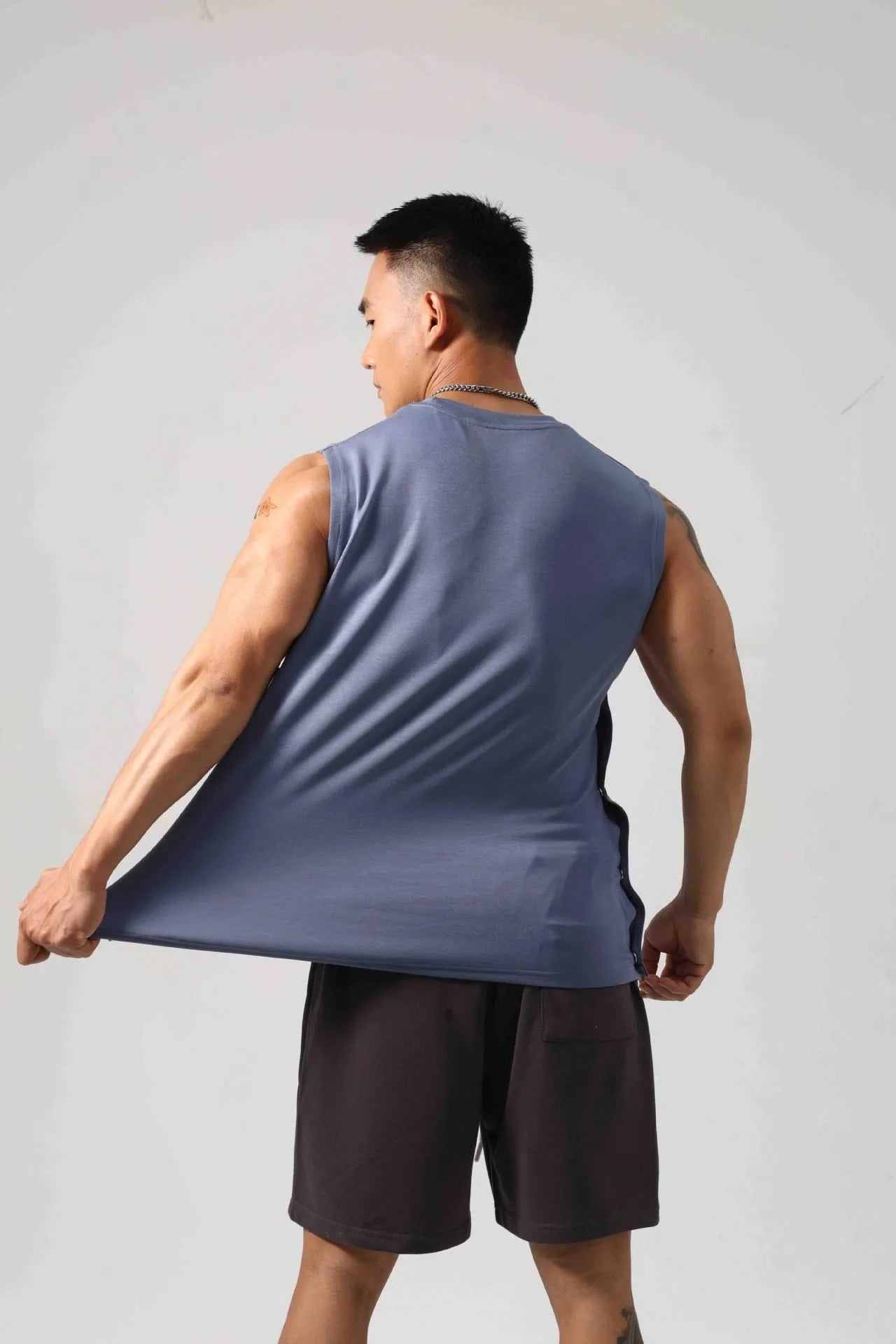 Korean style loose cotton fitness vest for men with hidden hook side openings.