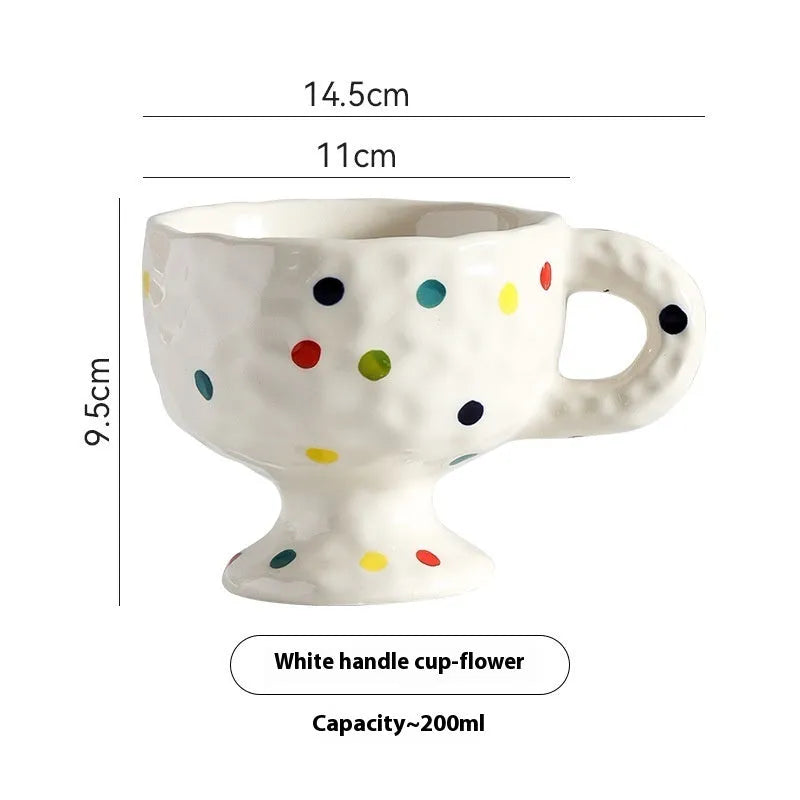 Hand-pinched irregular ceramic mug in solid colour with modern simple design