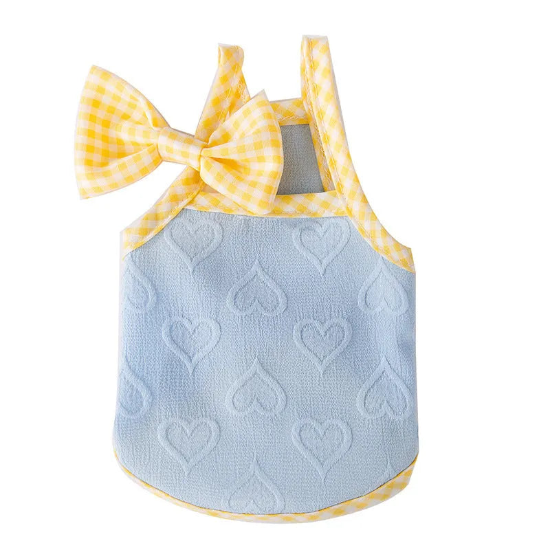 Small dog wearing heart relief texture bow suspenders vest in Bondi Blue colour