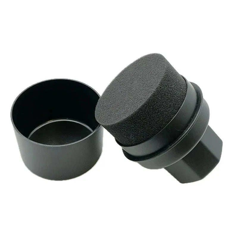Black and red tyre polishing sponge brushes with lids on a surface, showing hand-held design and sponge options.